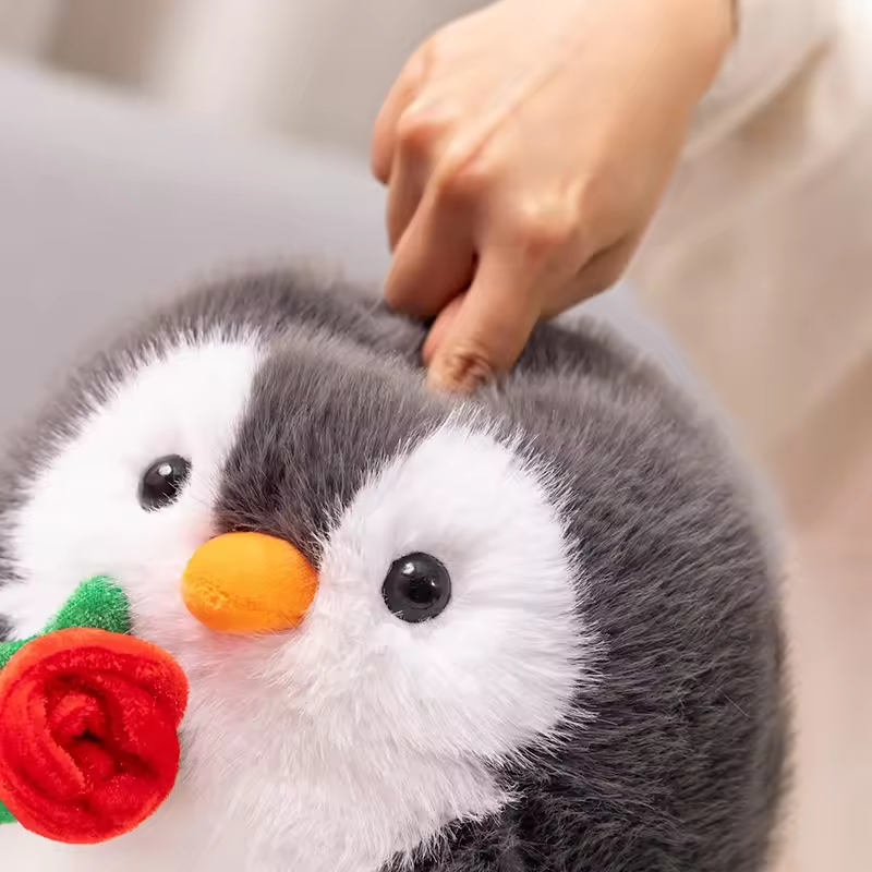 Fluffy Penguin Holding Rose Plush