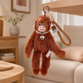 Compact Fuzzy Punch Monkey keychain with a playful novelty look
